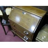 A Mid XX Century Walnut Bureau, with fall front, fitted interior, two drawers, on cabriole legs, pad