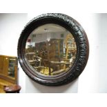 A Late XIX Early XX Century Oval Shaped Mirror, with acanthus and beadwork decoration, bevelled