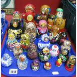 A Nice Collection of Over Twenty-Five Russian Doll Babushka's, varying sizes and designs including