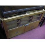 A XX Century Haberdashery Cabinet, with a glazed sliding doors, six internal shelves, over two