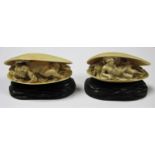 A Pair of Early XX Century French Ivory Conch Shells, carved with a reclining naked woman and a