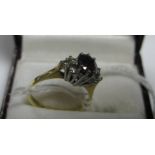An 18ct Gold Diamond Set Dress Ring, oval claw set to the centre between diamond set shoulders.