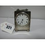 A Chester Hallmarked Silver Cased Bedside Clock, the circular dial with black Roman numerals and