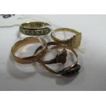 An Eternity Band, stamped "9ct"; a patterned wedding band, a 9ct gold signet style ring, etc. (5)