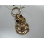 A 9ct Gold Pendant, with inset eyes, (import marks) Sheffield 1997.