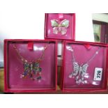 Butler & Wilson; Two Butterfly Necklaces, (sealed and boxed); together with a butterfly brooch. (3)