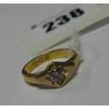 A 22ct Gold Band, with applied detail and central stone.