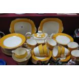 Grosvenor China Ye Old English Table Ware, of approximately fifty one pieces with mustard and gilt