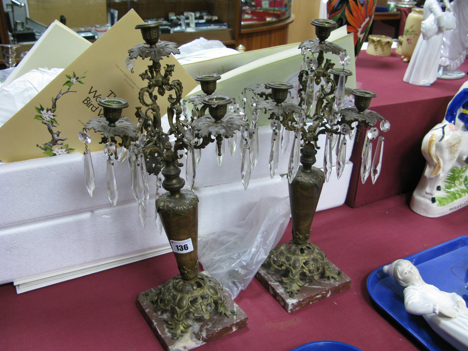 A Pair of Gilded Metal Table Lustres, each with with faceted cut glass drops to four branches on