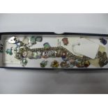 A Souvenir Charm Bracelet, suspending numerous enamel shield charm pendants; together with loose