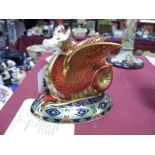 A Crown Derby Paperweight, modelled as The Wessex Wyvern, no. 769/200, gold stopper, with