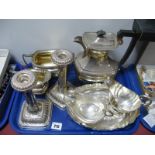 An Elkington & Co. Plated Three Piece Tea Set, together with a pair of decorative candlesticks, each
