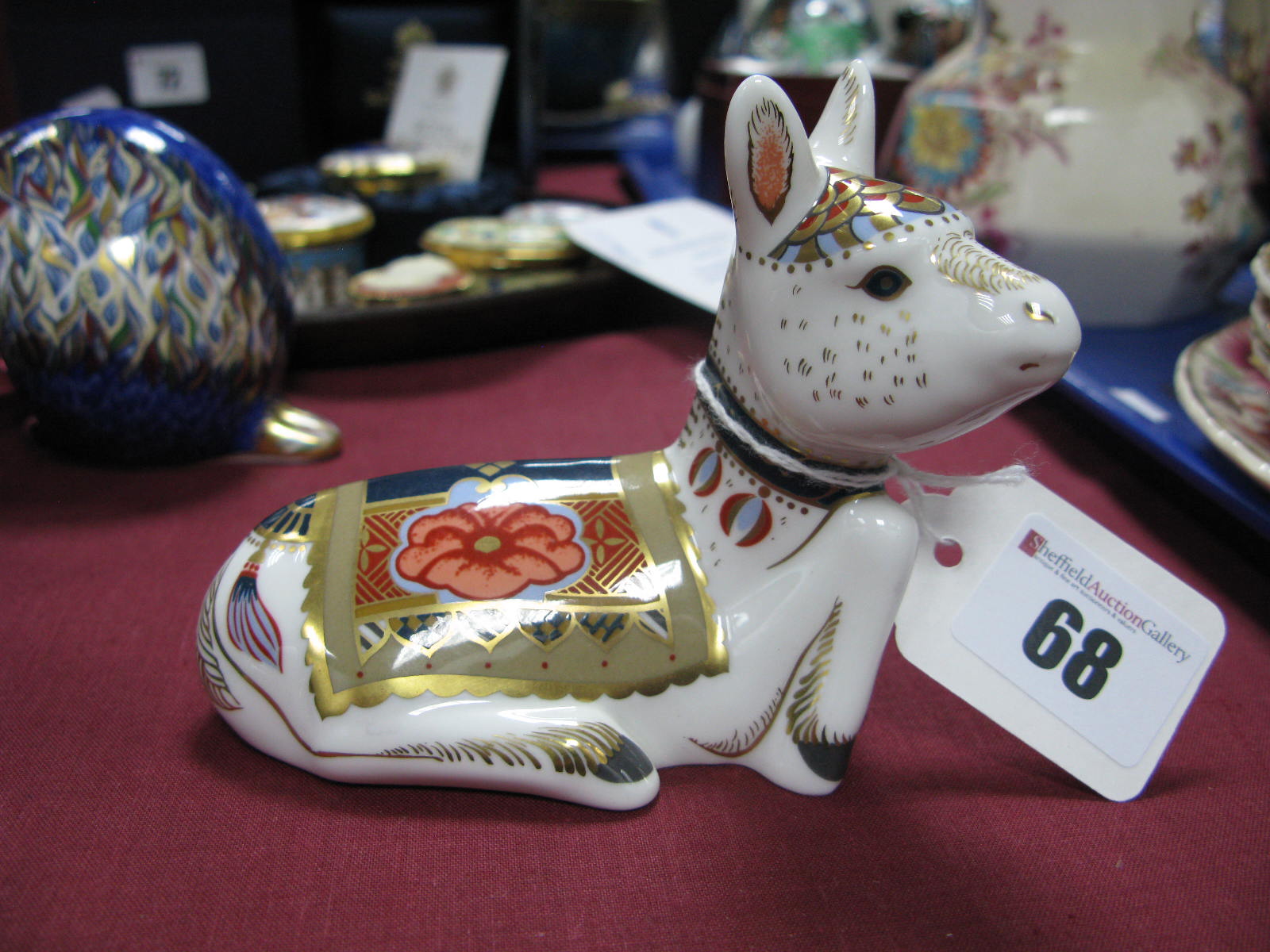 A Crown Derby Paperweight, modelled as Holly, issued in a limited number of 1500 during 2002,