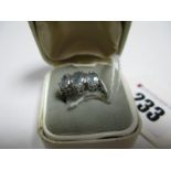 A 9ct White Gold Three Stone Ring, graduated claw set.