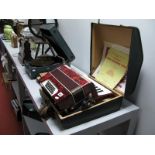 A Made In Germany Galotta 32 Bass Accordion, red marbled finish, in original carry case with '