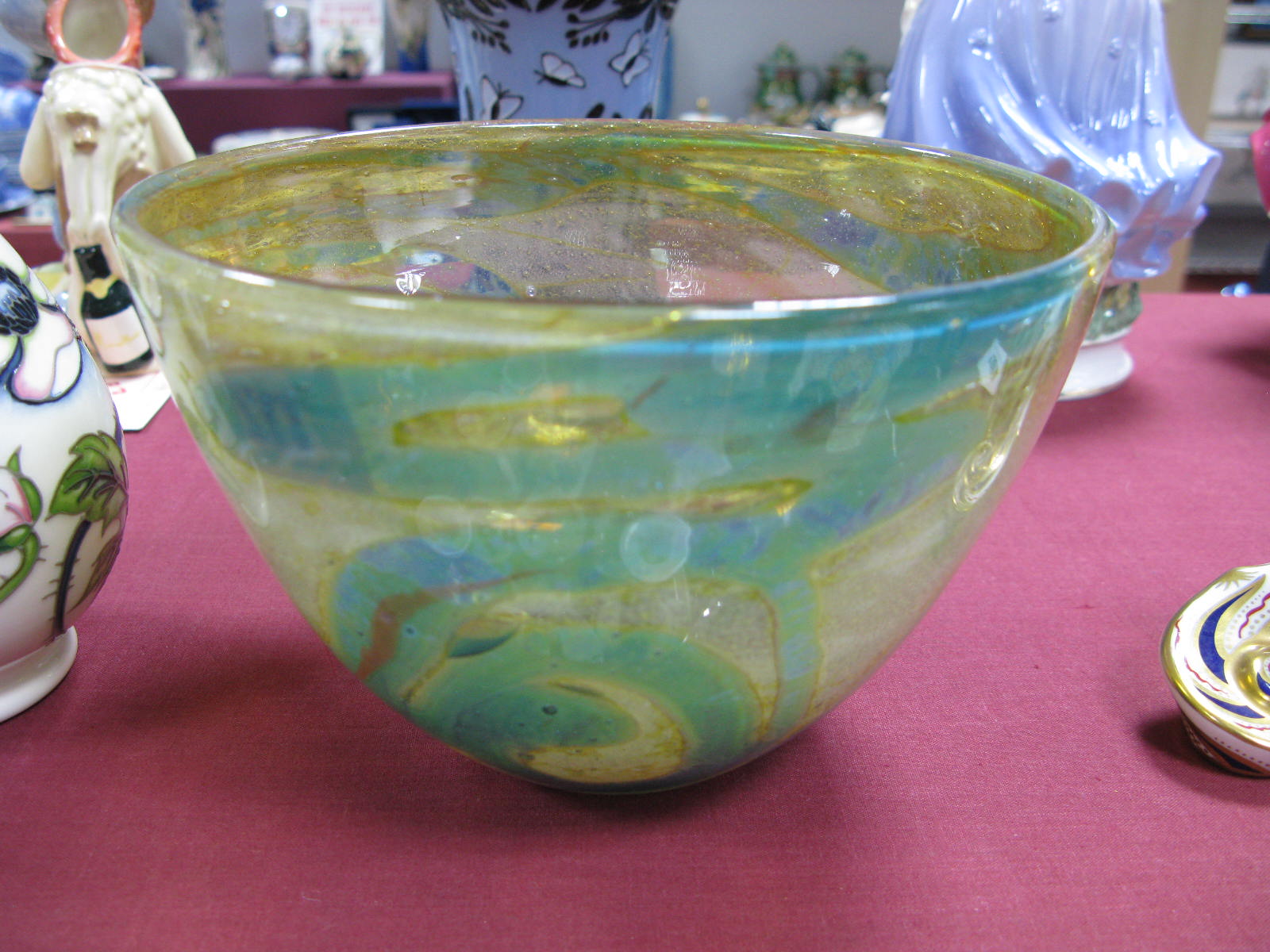 A Studio Glass Bowl, in the style of Mdina Rosenthal, with turquoise trails against a seafoam