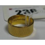 A 22ct Gold Wide Patterned Wedding Band.