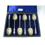 A Set of Six Hallmarked Silver Decorative Apostle Teaspoons, each with gilt lined shell bowl, in