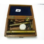 A Brass Lacquered Folding Microscope, circa 1900, on mahogany base, as a box.