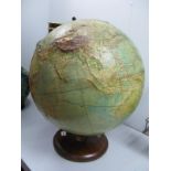 A Large Philip's Terrestrial Globe, (19" diameter), dated 1958 with raised surfaces showing