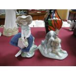 Lladro Pottery Girl with Flowers, 18cm high, Nao two puppy group. (2)