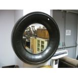 A Modern Circular Wall Mirror, in heavy cushioned frame, moulded edge, diameter overall 83cm.