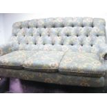 A Mckinney Floral Button Back, upholstered three seater settee.