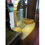 A Mid XX Century Birds Eye Maple Walnut Bow Front Dressing Table, of four drawers and two jewel