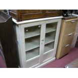 An Early XX Century Cabinet, twin glazed doors, fitted with three shelves, plinth base.