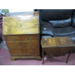 A Walnut Bureau, fall front over three long drawers, bracket feet and a walnut drop leaf