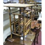 A Cream Painted Two Drawer Bookcase; together with a XIX Century bamboo table. (2)