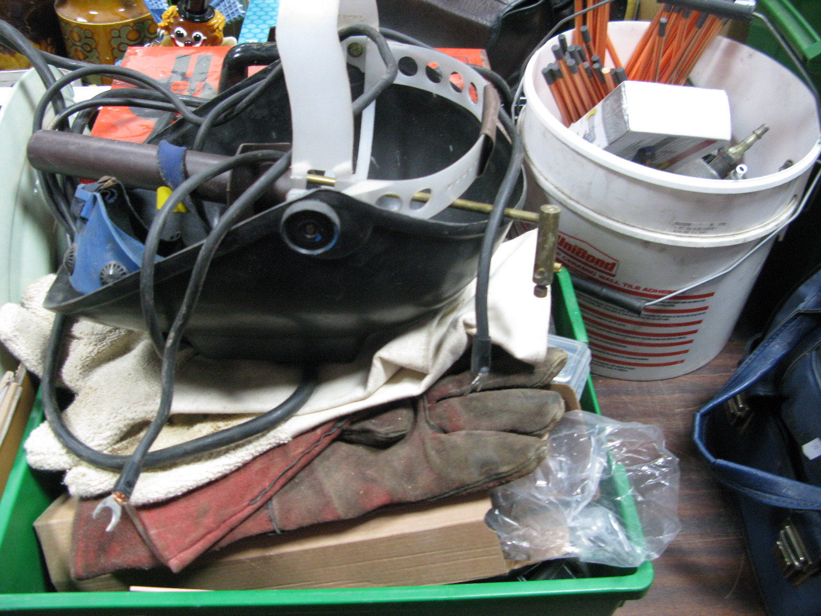 A Weldmaster SM100 Welding Transformer, welding rods, face protector, gloves, etc.