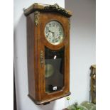 A Late XIX Century Wall Clock, with a Junghans movement and a silvered dial with Arabic numerals,