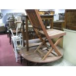 A Modern Circular Topped Hardwood Folding Garden Table, and four chairs. (5)