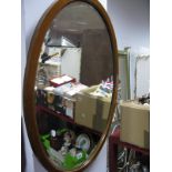An Edwardian Inlaid Mahogany Framed Oval Bevelled Wall Mirror; two others. (3)