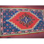 A Turkish Multicoloured Tasseled Wool Rug, with floral and geometric design, 157 x 89cm.