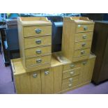 A Pair of Yew Effect Bedside Chests, each of four drawers having low gallery back. A Yew Effect