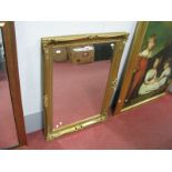 A Rectangular Bevelled Glass Wall Mirror, in a Victorian style gilt scroll frame, 74 x 49cm.
