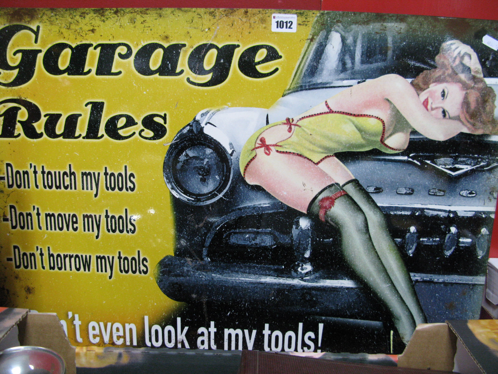 A Metal Wall Sign Advertising "Garage Rules", 50 x 70cm.