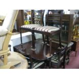 A Reproduction Mahogany Drop Leaf Table and four matching chair frames. (5)