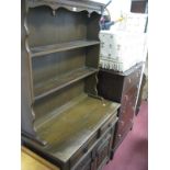 An Oak Dresser, with two shelf rack and linen fold cupboard doors.