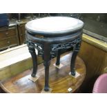 A Chinese Hardwood Jardiniere Stand, of oval form having pierced apron on cabriole legs.