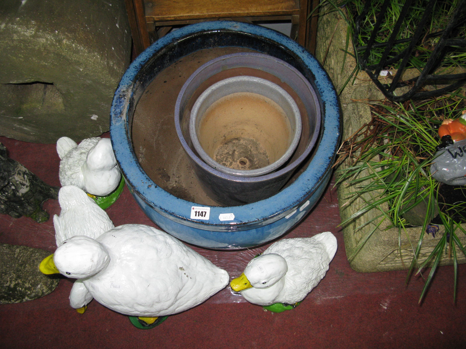 A Large Glazed Pottery Planter, in blue, diameter 44cm, further glazed plant pots and four cast