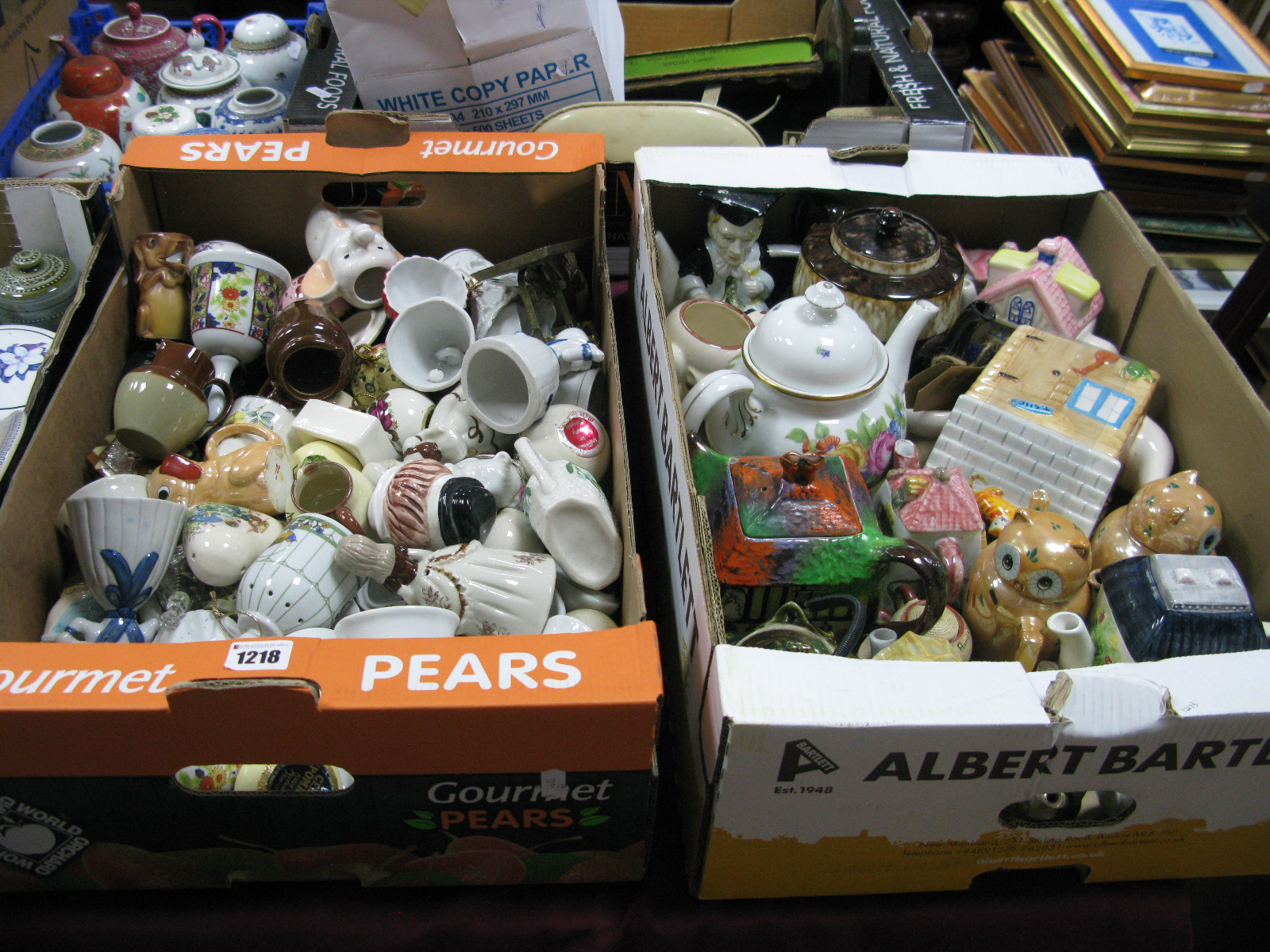 A Quantity of Teapots, bells, etc:- Two Boxes