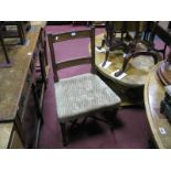 A Set of Four Early XIX Century Mahogany Dining Chairs, with a rectangular top rail, upholstered