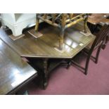 An Early XX Century Walnut Window Table, with octagonal top, turned, block and spiral twist supports