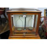 A Mahogany Cased Set of Chemists Scales, applied label 'Griffin and George Ltd'.