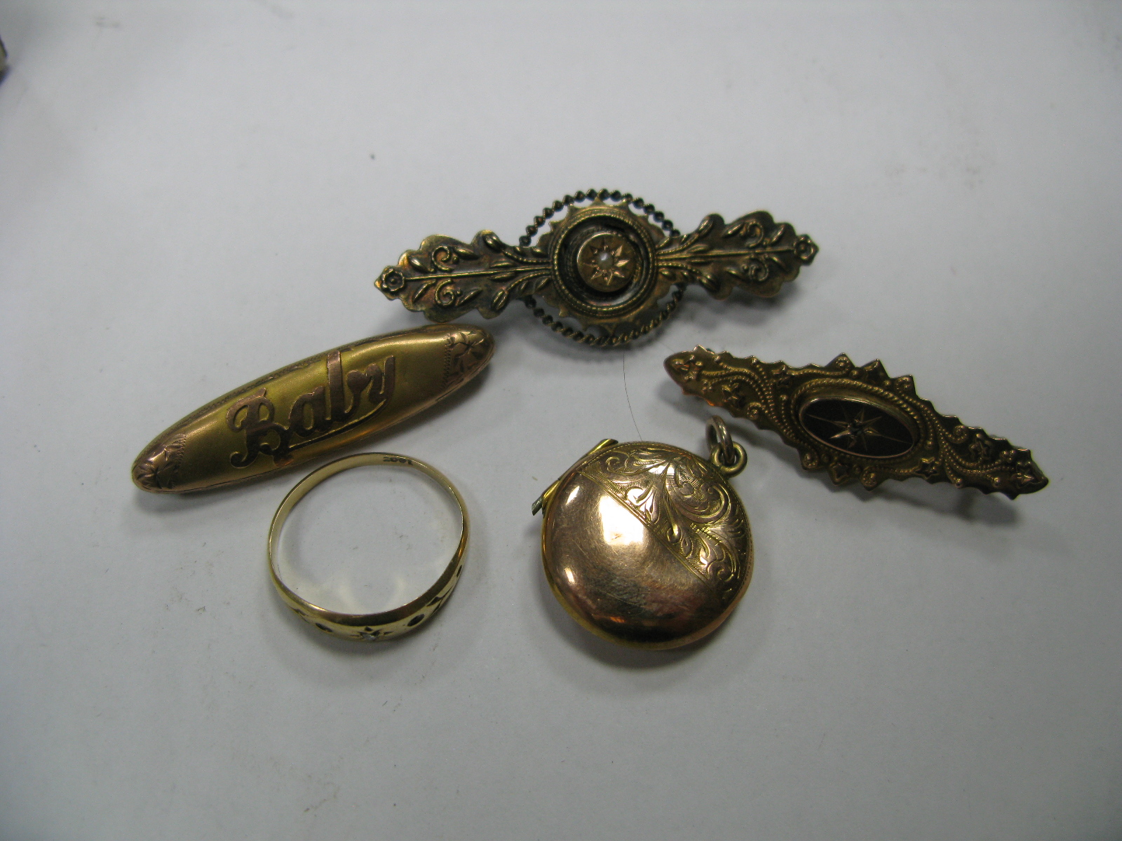 A Circular Locket Pendant, "Baby" brooch, a locket back bar brooch diamond chip set bar brooch and a