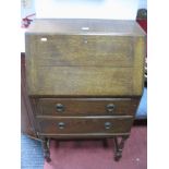 Oak Bureau, circa 1930's, with fall front over two drawers, on turned and block supports, bearing