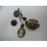 A XIX Century Brooch, oval collet set within openwork border; an oval cameo brooch, a Victorian coin